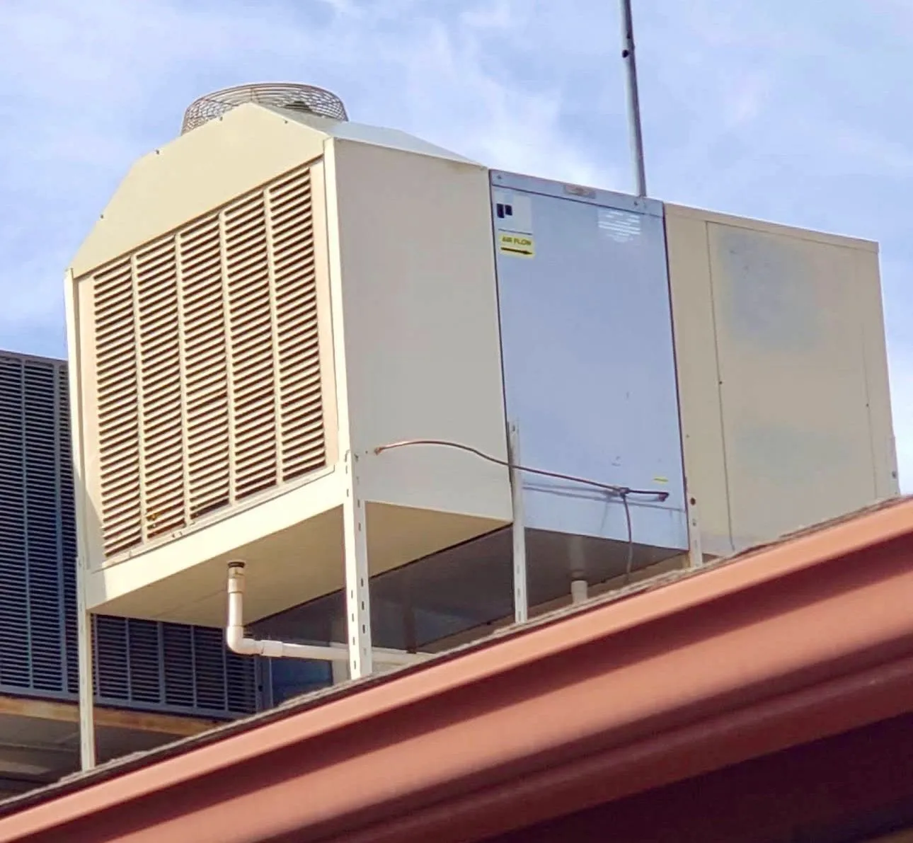 Commercial evaporative cooler installed on a roof